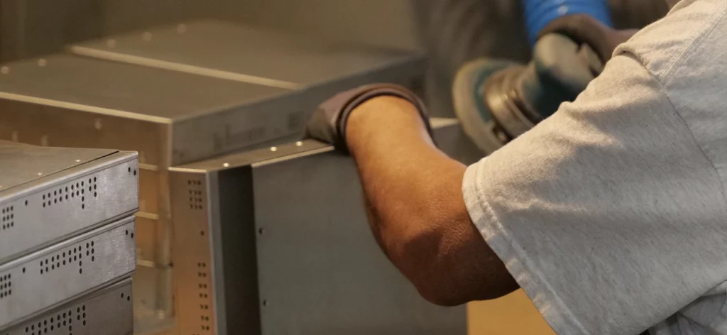 man grinding metal