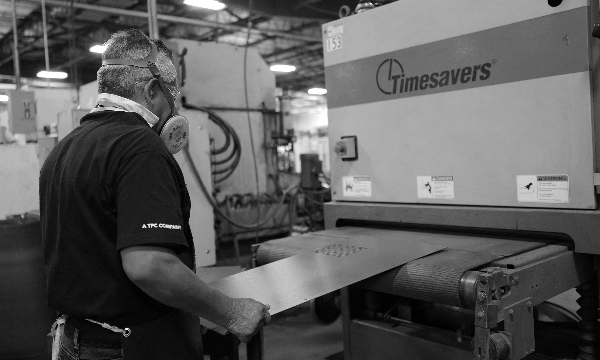 man doing piece of work on a table